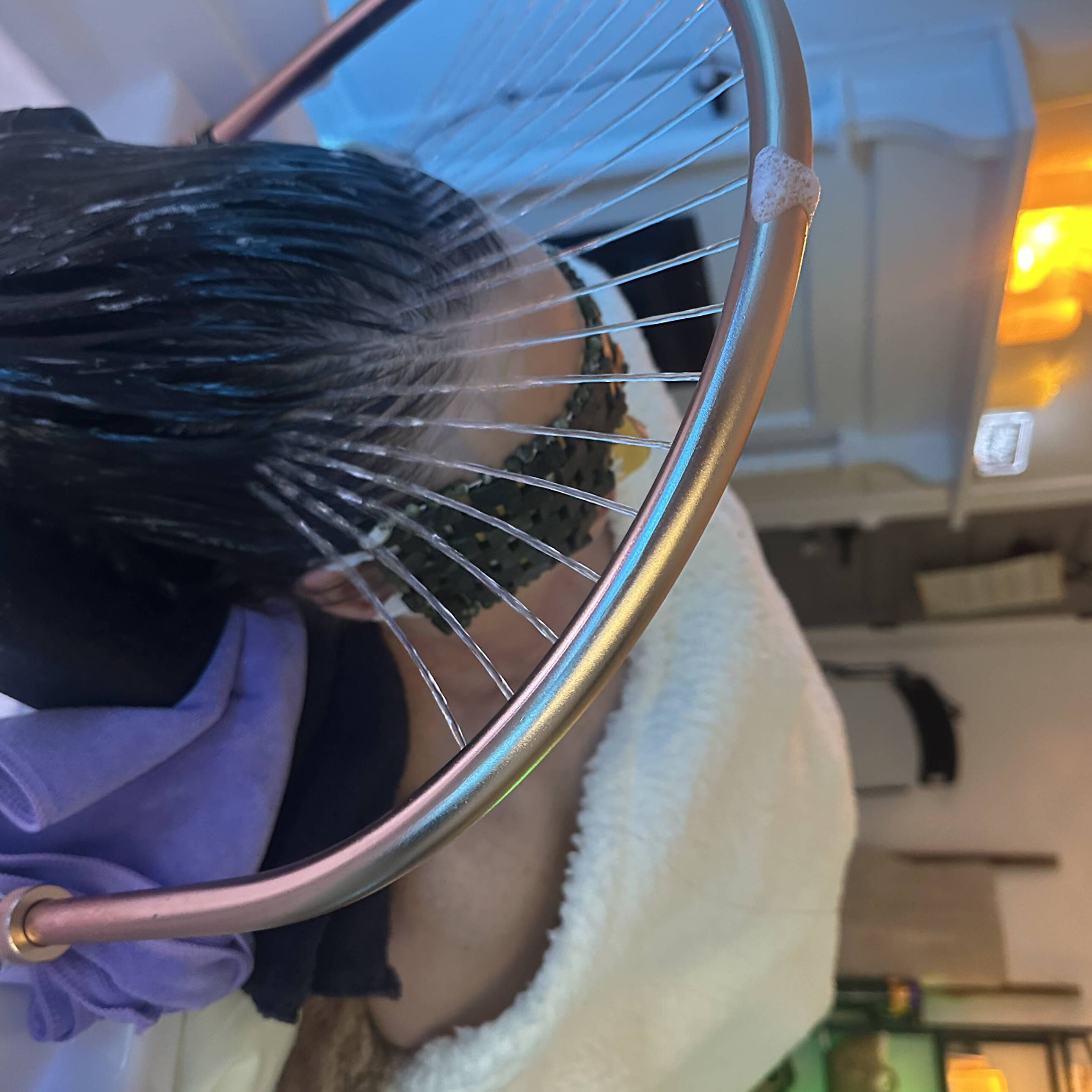 Client enjoying a head spa water treatment